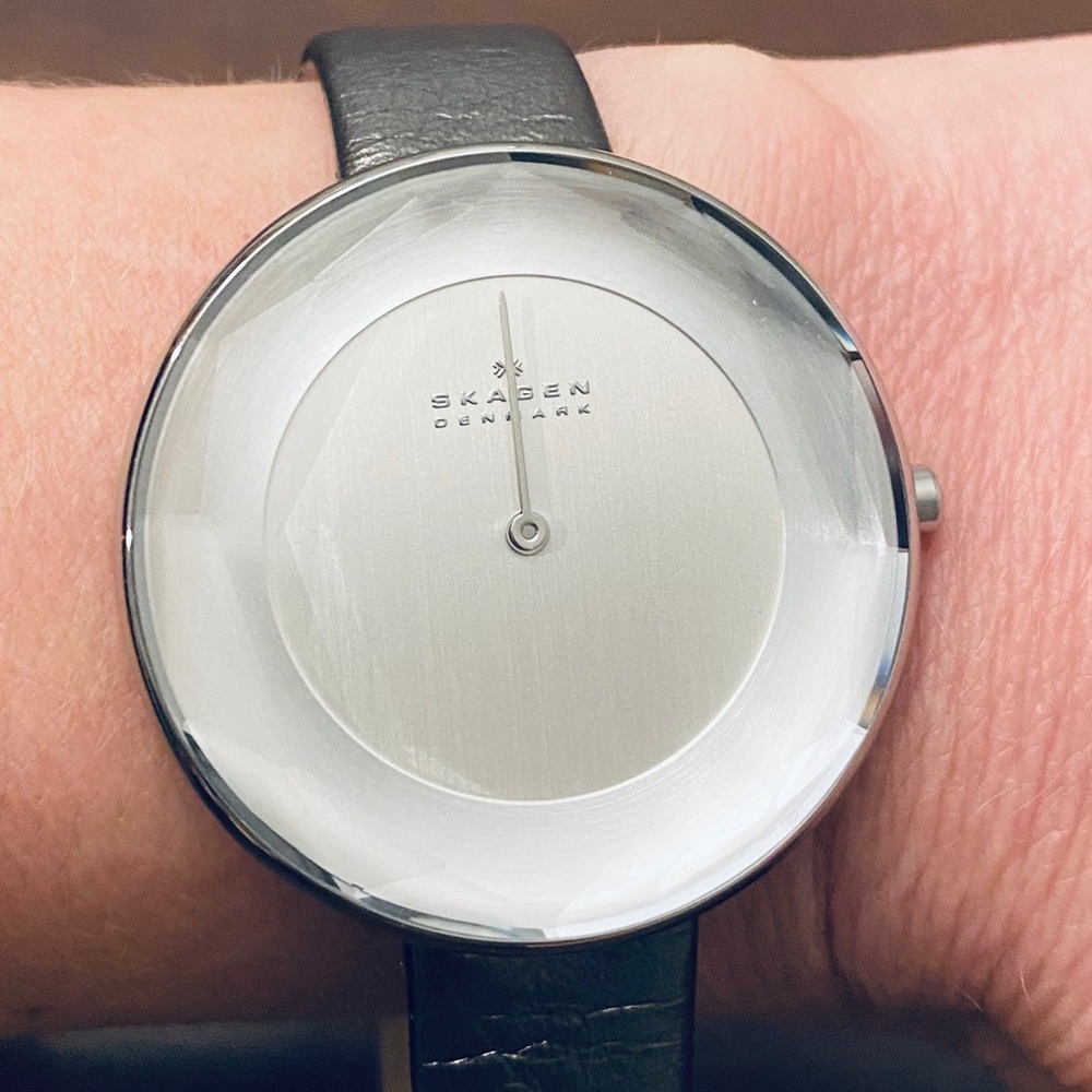 Skagen watch with metallic leather band.